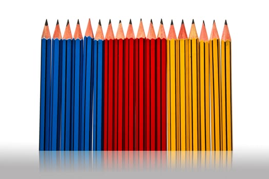 Pencils Blue Red and Yellow Isolated on White Background and reflected grey