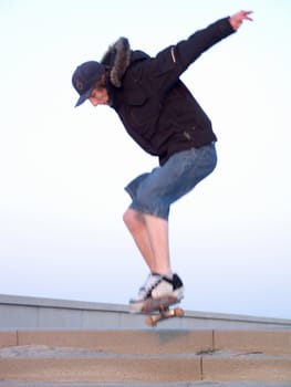 Awesome - Modern Teen doing a stunt on skate board in the city