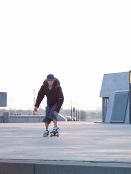 Lining up for the jump - Modern skateboarderon his skate board