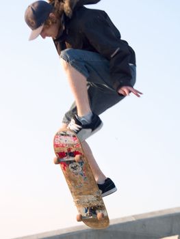 Young skateboarder getting some air on his skate board