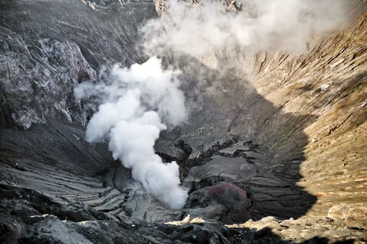 Smoking crater detail in Indonesian volcano Bromo