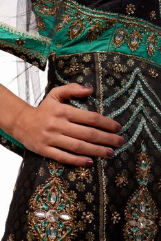 Detail take of a traditional sari, hand on hip