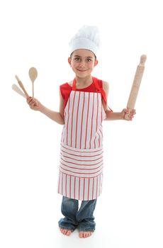 A little chef or cook holding wooden kitchen utensils.  White background.