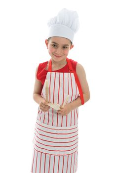 A young smiling chef holding kitchen utensils.  White background.