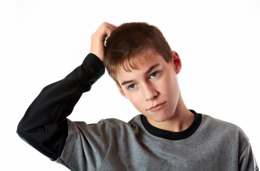 white teen scratching his head and looking thoughtful