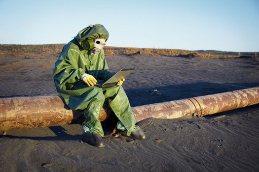 Environmental scientist working in the zone of ecological disaster