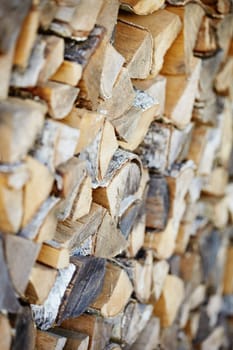 Firewood from birch logs close up - the background