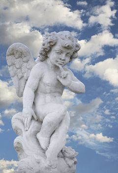 Beautiful angel boy statue with pretty sky