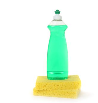 Dishwashing Liquid in a Bottle With 2 Yellow Sponges on White With Copy Space