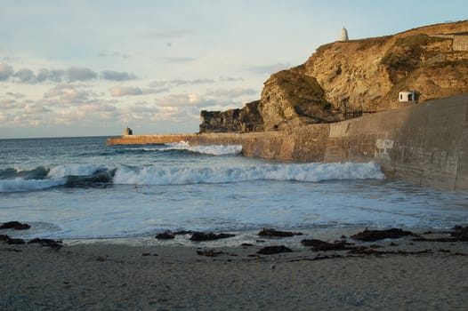 Portreath Pier Jetty on Portreath Harbour Cornwall with Moderate Waves