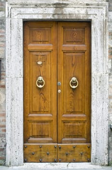 Old wooden door decorated. Italian style