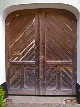 Old classical wooden door gate of a farm