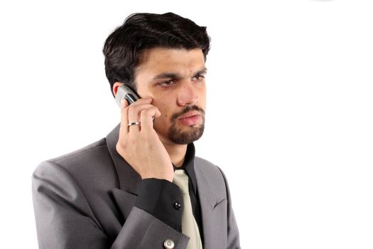 An Indian businessman talking on a cellphone.