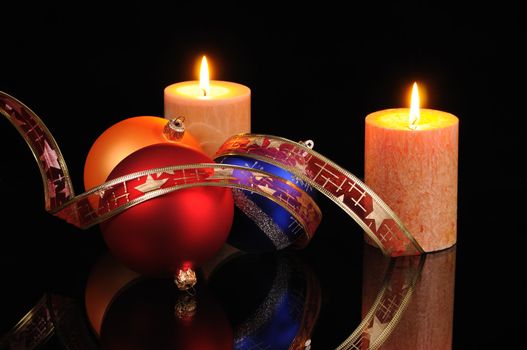 Christmas decoration with candles on a black background