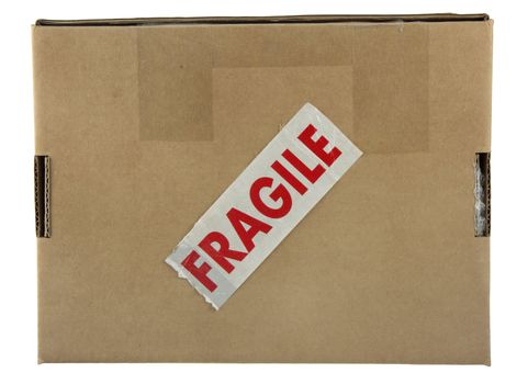 a small carboard box with red fragile label (tape) isolated on white with clipping path