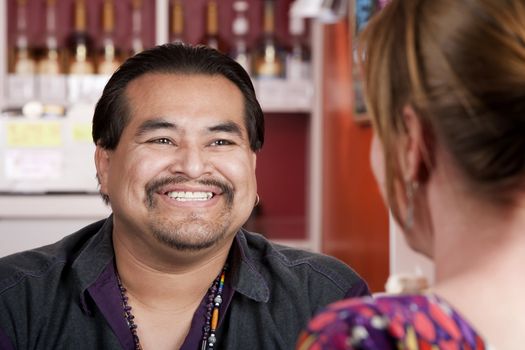 Handsome Native American man with female friend in a restaurant