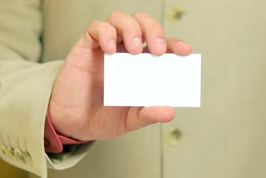 white business card in a hand