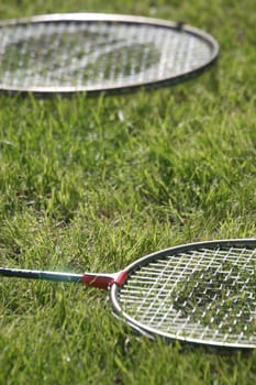 Badminton racquets on the grass
