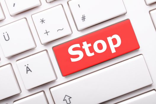 stop key on keyboard in red showing halt concept