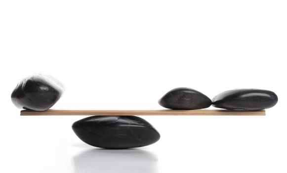zen stones scales isolated on white showing weight or spa concept with copyspace