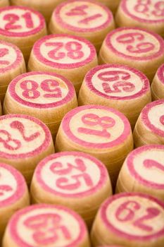 Wooden counters of bingo with red digits
