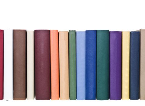 Books in a row isolated on white background