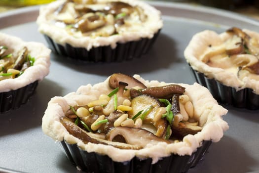 Fresh shitake mushrooms, pine nuts and chives, just add eggs and bake.