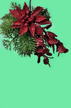 Christmas ornament with red bow isolated on green  background with copy space.
