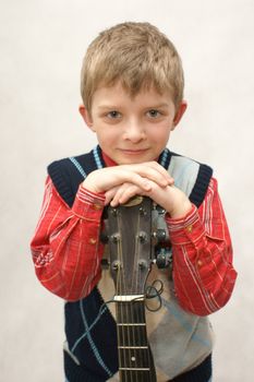 young boy with book in white background