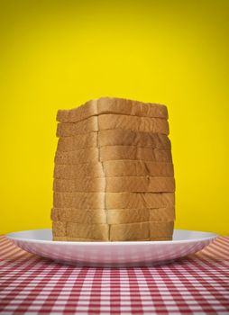 Sliced loaf of bread served on a table.