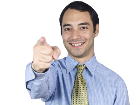 A young businessman smiling and pointing at you.