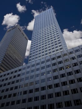 New York skyscraper against a blue sky and some clouds.