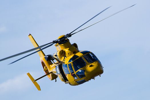 Close up Helicopter flying in cloudy sky