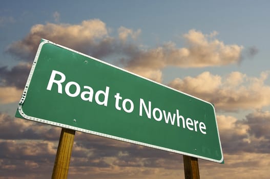 Road to Nowhere Green Road Sign with dramatic clouds and sky.
