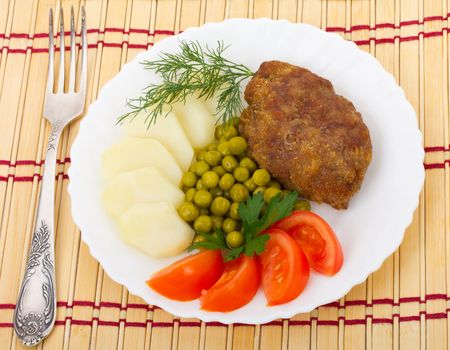 close-up meat rissole with vegetables, isolated on white