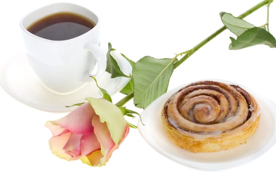 close-up cake with cinnamon, tea and rose, isolated on white