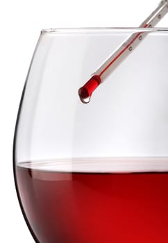 Red wine temperature. A thermometer on a wine glass