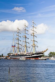 SAIL AMSTERDAM 2010 -IJMUIDEN, THE NETHERLANDS - AUGUST 2010: Sail 2010 starts with the spectaculair Sail-in Parade.  50 Tall ships and more than 500 of  naval ships, replicas and yachts sail in convoy through the North Sea Canal from IJmuiden to Amsterdam. Thousands of private boats accompany the fleet and more than 300.000 visitors watch the parade from the banks. August 19, 2010, IJmuiden, the Netherlands