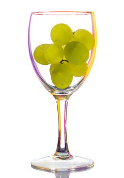 wine glass with grapes, isolated on white
