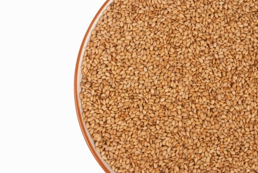A bowl full of sesame seeds, food background