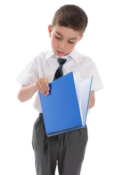 Young school boy with a blue ring binder workbook.  White background.