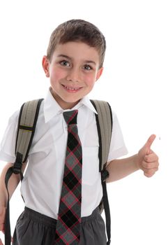 A young boy schoolboy wearing school uniform.  He is smiling and showing a thumbs up hand sign.