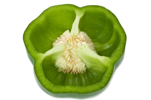 Close up of a single green bell pepper halve, isolated over white.