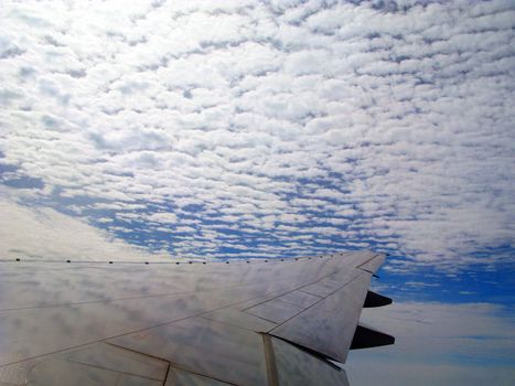 An Aeroplane flying High in the Clouds