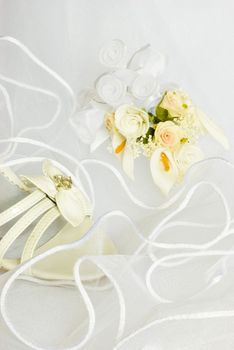 wedding sandals and flowers decoration over bridal veil