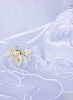 bridal bag wedding flowers decorations over bridal veil