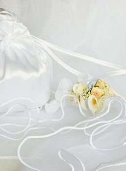 bridal bag wedding flowers decorations over bridal veil