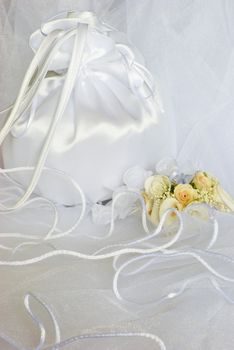 bridal bag wedding flowers decorations over bridal veil