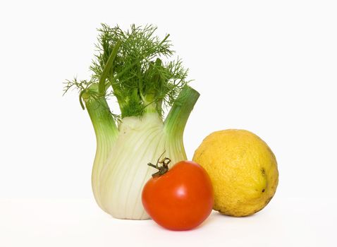 Fennel, tomato and lemon isolated on white background