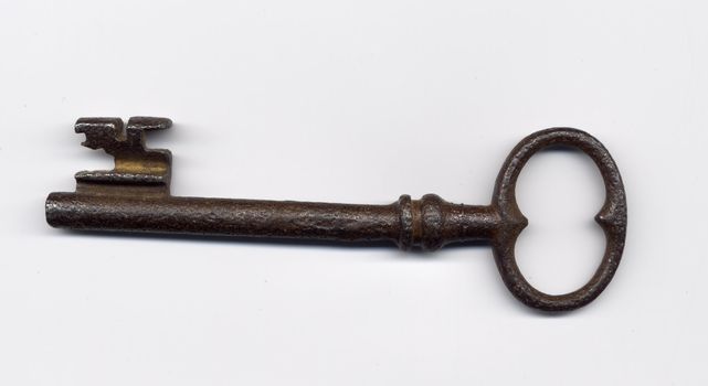 old metal key on white background